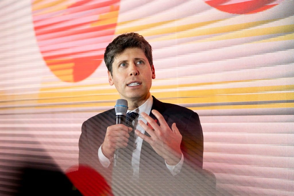 Sam Altman на мероприятии, фото из материала TechCrunch о роспуске Mission Alignment team OpenAI