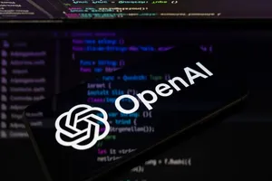 Логотип OpenAI на смартфоне на фоне кода, иллюстрация к новости о Codex для knowledge work